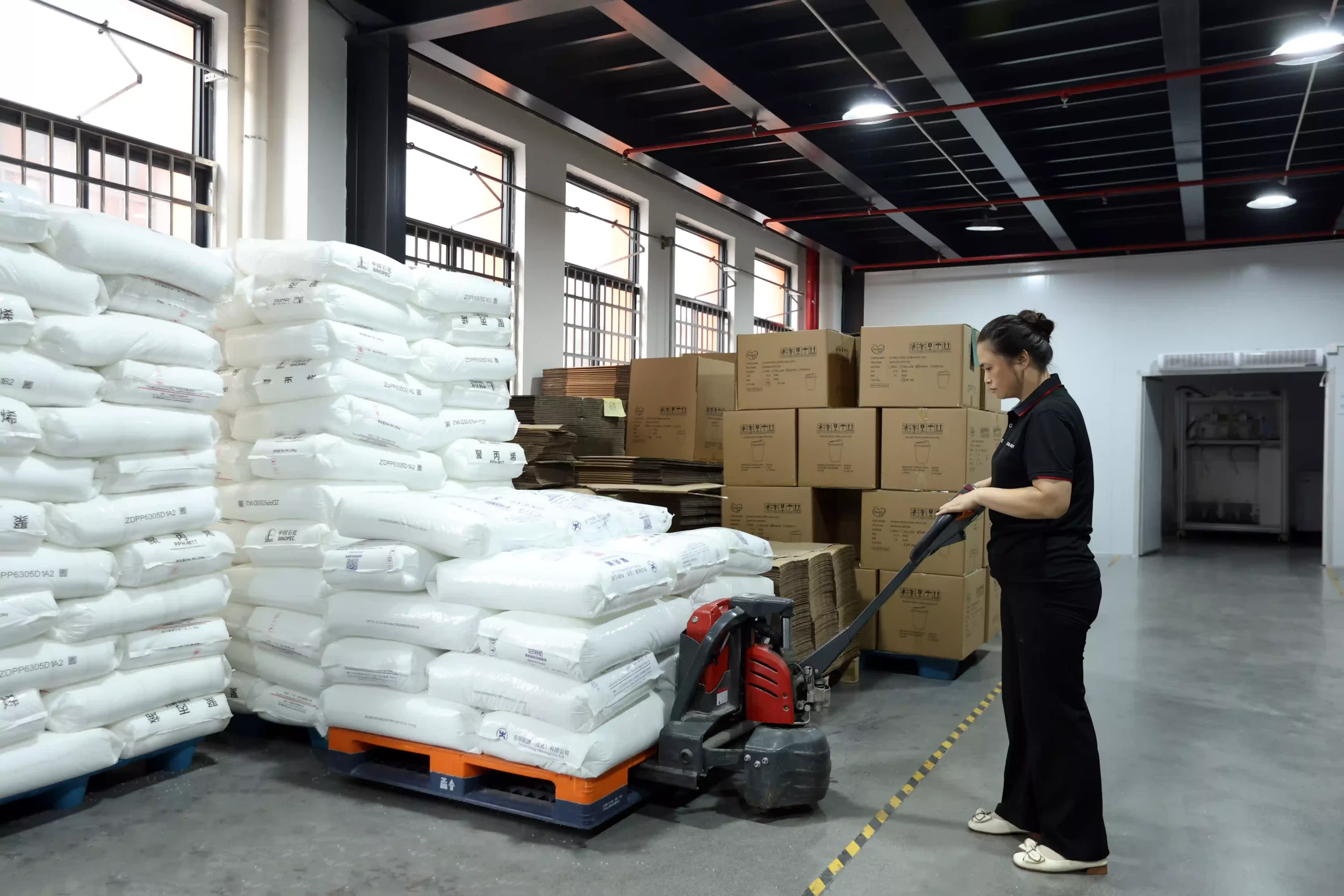 Centralized polymer dehumidifying and vacuum feeding system