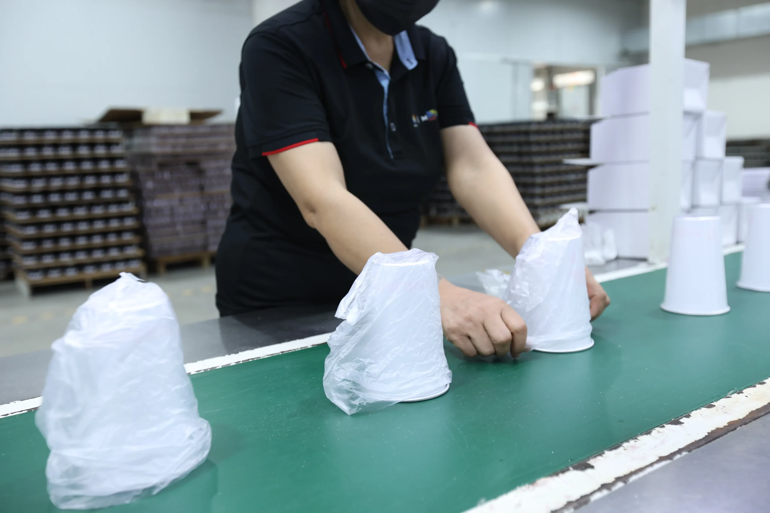 Automated export outer carton packing and shrink wrapping