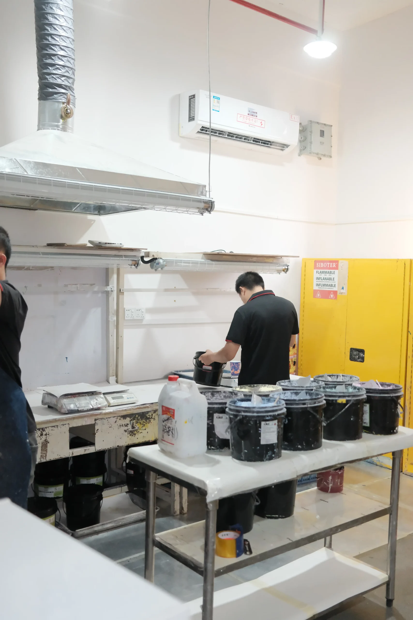 Specialists tuning pigment temperature response in the formulation laboratory