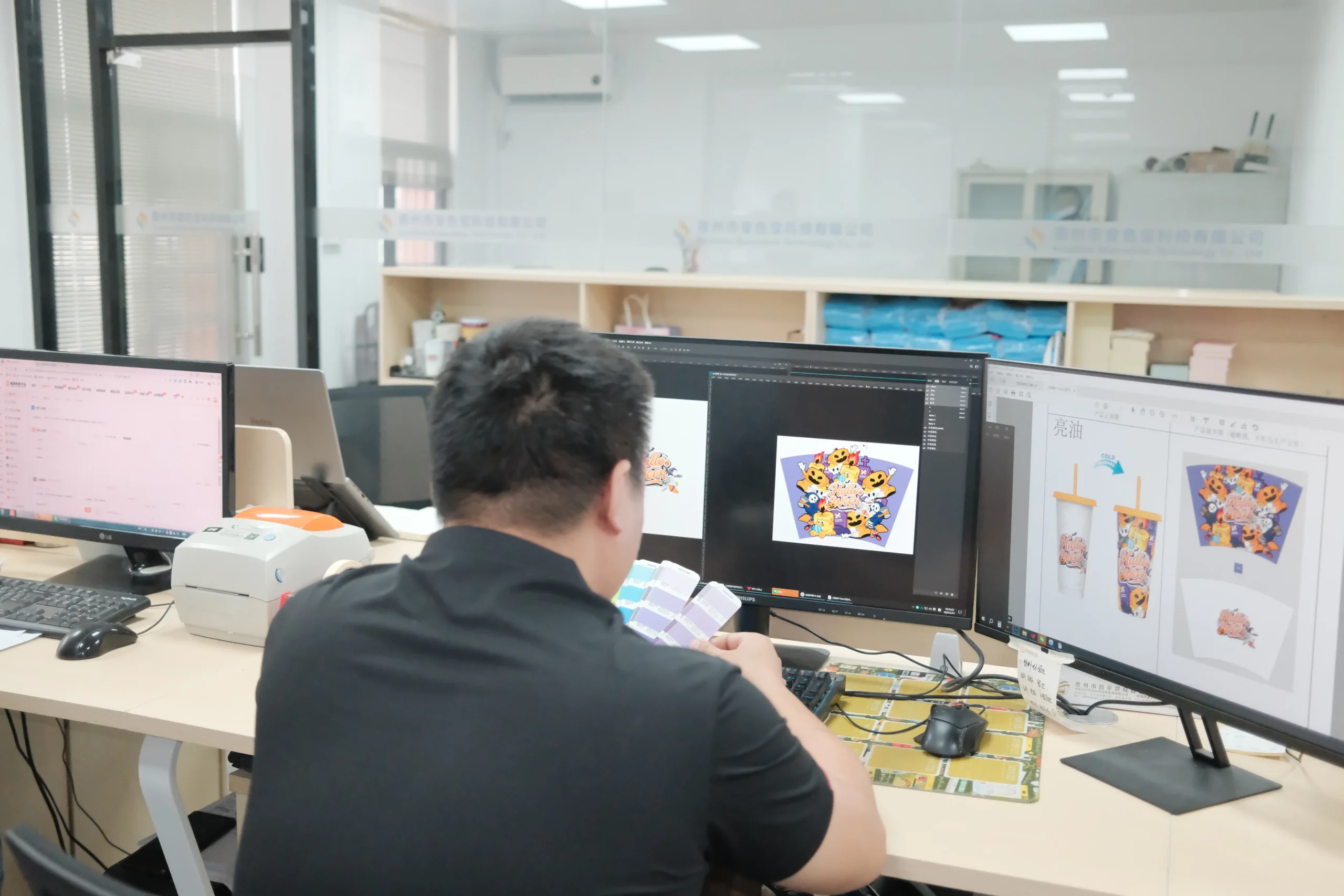 Creative design team reviewing color-shifting renders and artwork proofs